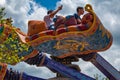 People enjoying The Magic Carpets of Aladdin sign in Magic Kingdom at Walt Disney World 3