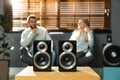 People enjoying music with modern audio speaker system in living room Royalty Free Stock Photo