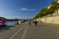 People enjoying nice summer weather at the banks of Vltava river in Prague, Czech republic Royalty Free Stock Photo