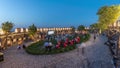 People are enjoying the open air cinema in the hictoric building at evening timelapse Royalty Free Stock Photo
