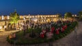 People are enjoying the open air cinema in the hictoric building at evening timelapse Royalty Free Stock Photo