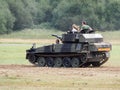 People Enjoying a Ride in an Armoured Car at Dunsfold Airfield