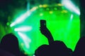 People enjoying rock concert and taking photos with cell phone a Royalty Free Stock Photo