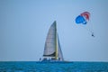 People enjoying of sailboat and parasail on colorful sunset background in Gulf Coast Beaches 1