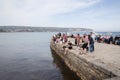 People enjoying the seafront in Swanage, Dorset in the UK