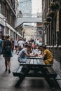 People enjoying street food in Ely`s Yard, London, UK.