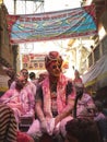 A young Indian Male with face glass playing holi at mathura vrindavan India, People enjoying festival