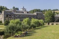 People enjoying the summer close to the Benedictine Monastery of San XuliÃÂ¡n in Samos, Galicia, Spain.