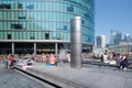 People enjoying summer at a fountain in London