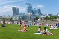 People enjoying summer near Tower Bridge in London