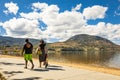 People enjoying the summer sunshine at Okanagan Beach, a popular holiday destination