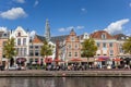 People enjoying the sun at a historic canal in Haarlem Royalty Free Stock Photo