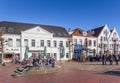 People enjoying the sun at the market square in Jever