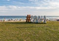 People enjoying a sunny day at the Barra da Tijuca Beach, Rio de Janeiro.