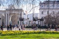 People enjoying a sunny day in London, riding bicycles or walking in Hyde Park.