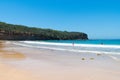 People enjoying the sunny weather at Pebbly Beach, a popular camping area with great surfing beach and bush walks within Royalty Free Stock Photo