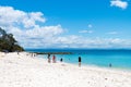 People enjoying the sunny weather at the tranquil, white-sand Murrays Beach in Jervis Bay, Booderee National Park, NSW, Australia