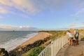 People enjoying the sunrise view from Lambert`s Beach lookout, Mackay Queensland Australia