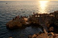 People enjoying the sunset at Baluota Monte beach in Rovinj, Croatia Royalty Free Stock Photo