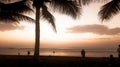 People enjoying the sunset on the beach Royalty Free Stock Photo