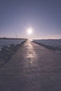 people enjoying sunset on the breakwater in the sea with lightho Royalty Free Stock Photo