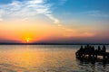 People enjoying sunset on a lake. Royalty Free Stock Photo