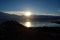 People enjoying the sunset over snowy mountain and calm fjord Royalty Free Stock Photo