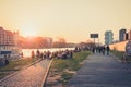 People enjoying sunset at river next to the Berlin Wall / East Side Gallery  in Berlin, Germany Royalty Free Stock Photo