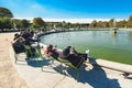 People enjoying sunshine in the garden of Palais-Royal, Paris Royalty Free Stock Photo