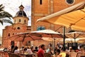 People enjoying in terraces in the main square of Altea