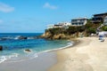 People Enjoying a Tropical Paradise with Ocean, Beach and Cliff Views Royalty Free Stock Photo