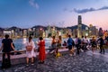 Hong Kong, China - People enjoying the view of the city harbour side