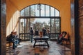 People enjoying the view of the gardens from Big Hall inside Alcazar of Seville palace, Spain Royalty Free Stock Photo