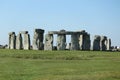 People enjoying view of Stonehenge, Neolithic ancient standing stone circle monument, UNESCO World Heritage Site