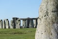 People enjoying view of Stonehenge, Neolithic ancient standing stone circle monument, UNESCO World Heritage Site