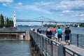 People enjoying warm summer day at the Old Port near the Clock Tower