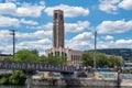 People enjoying a warm sunny day along Lachine Canal with Atwater tower in the background