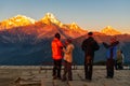 People enjoyying Majestic view of Annapurna south, himchuli and Fishtail mountain during sunset