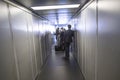 People enter the aircraft via a passenger bridge