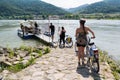 People entering ferry across Danube river in Durnstein, Wachau i