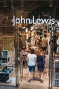 People entering John Lewis shop inside St. Pancras station, London, UK.