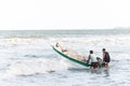 People entering the sea with a motorboat. Guaibim Beach, city of Valenca, Bahia Royalty Free Stock Photo