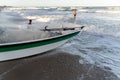 People entering the sea with a motorboat Royalty Free Stock Photo