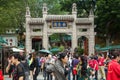 People at the entrance to the Wong Tai Sin Temple in Hong Kong