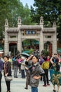 People at the entrance to the Wong Tai Sin Temple in Hong Kong