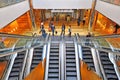 People on escalators in a shopping mall Royalty Free Stock Photo