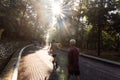 People exercise brisk walk in natural park with morning sun Royalty Free Stock Photo