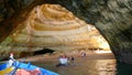 People Exploring caves on the boat - Portugal