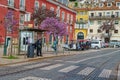 People exploring the narrow streets of Alfama in Lisbon