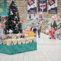 People in face mask with buys christmas baubles in gift shop. Lifestyle, a celebration of the coronavirus pandemic - Moscow, Royalty Free Stock Photo